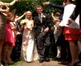 Emma and Ben walking through guests
